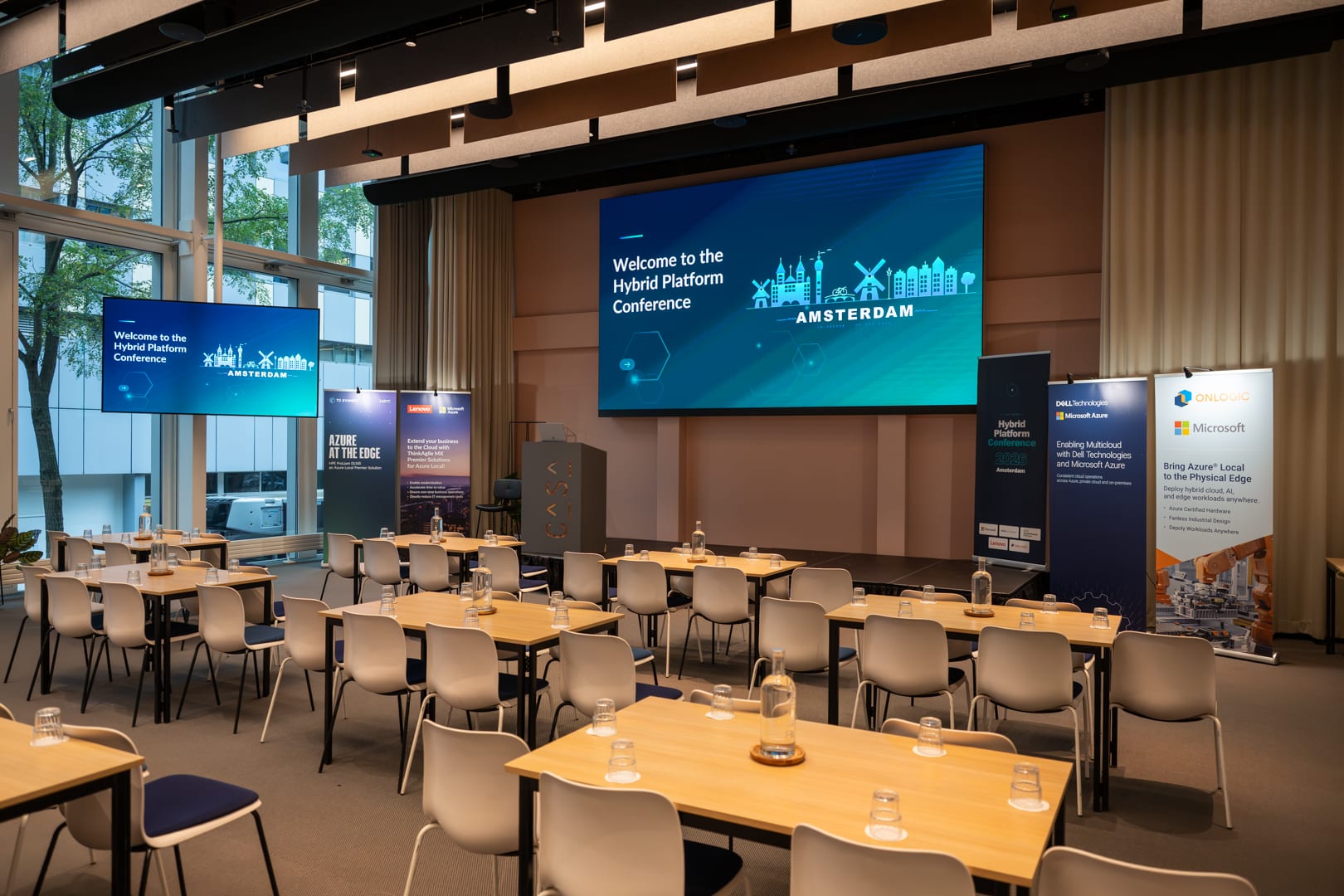 The main room set up before the doors opened, with the Hybrid Platform Conference Amsterdam welcome screen